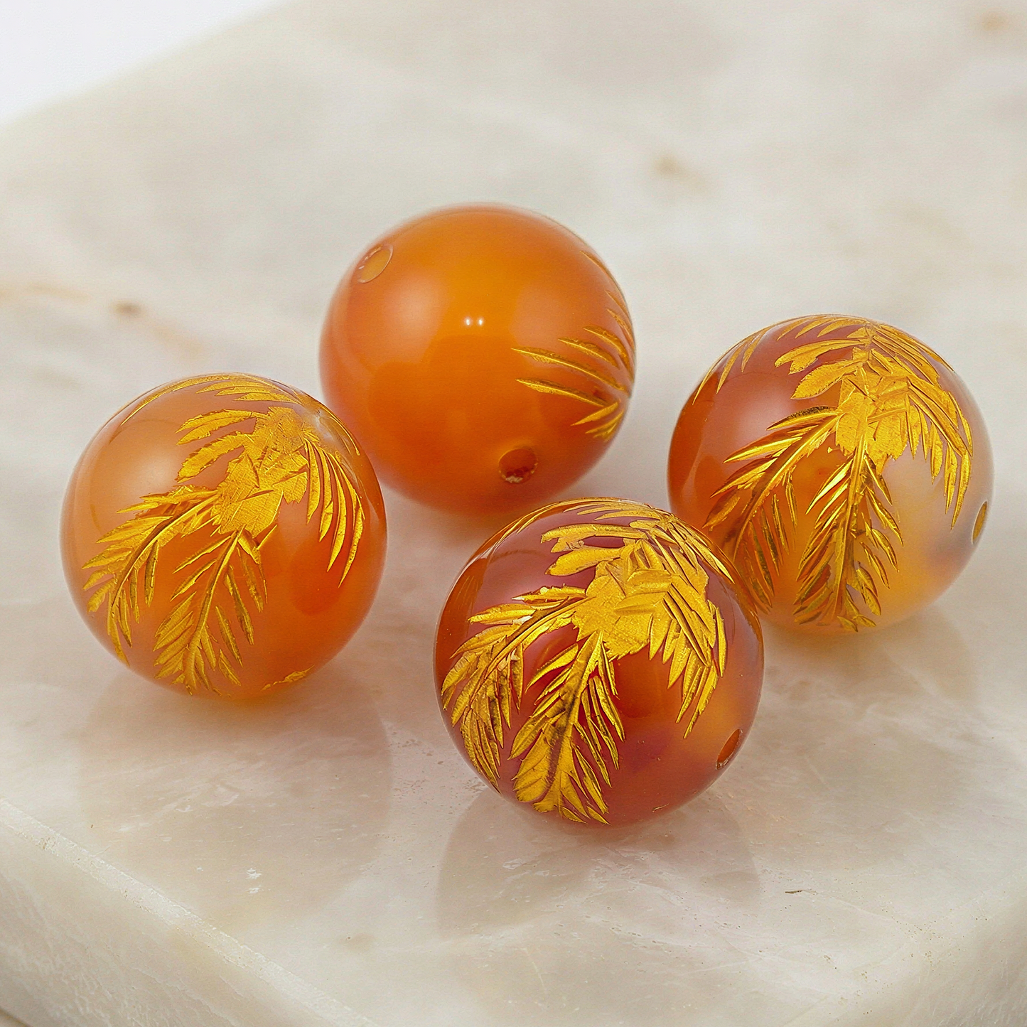 Polished carnelian phoenix carved 12mm round bead showcased with refined clarity, warm tones, and subtle natural texture