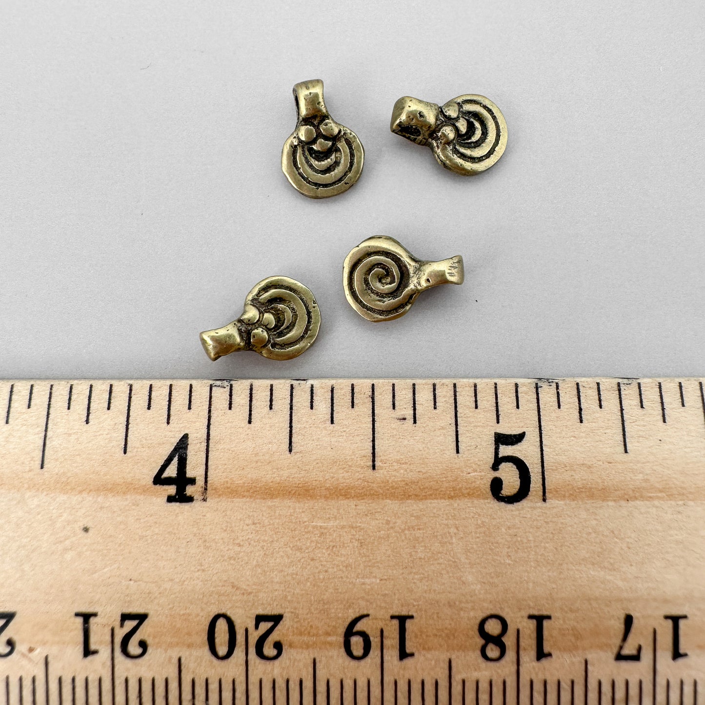 Small 7mm Rustic Brass Swirl Pendant  - 4 pcs. (M1859)