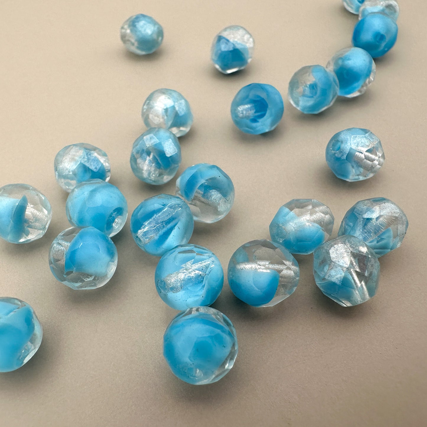 Vintage German 7x8mm Faceted Clear with Light Blue Core Oval Glass Bead - 4 pcs. (Z312)