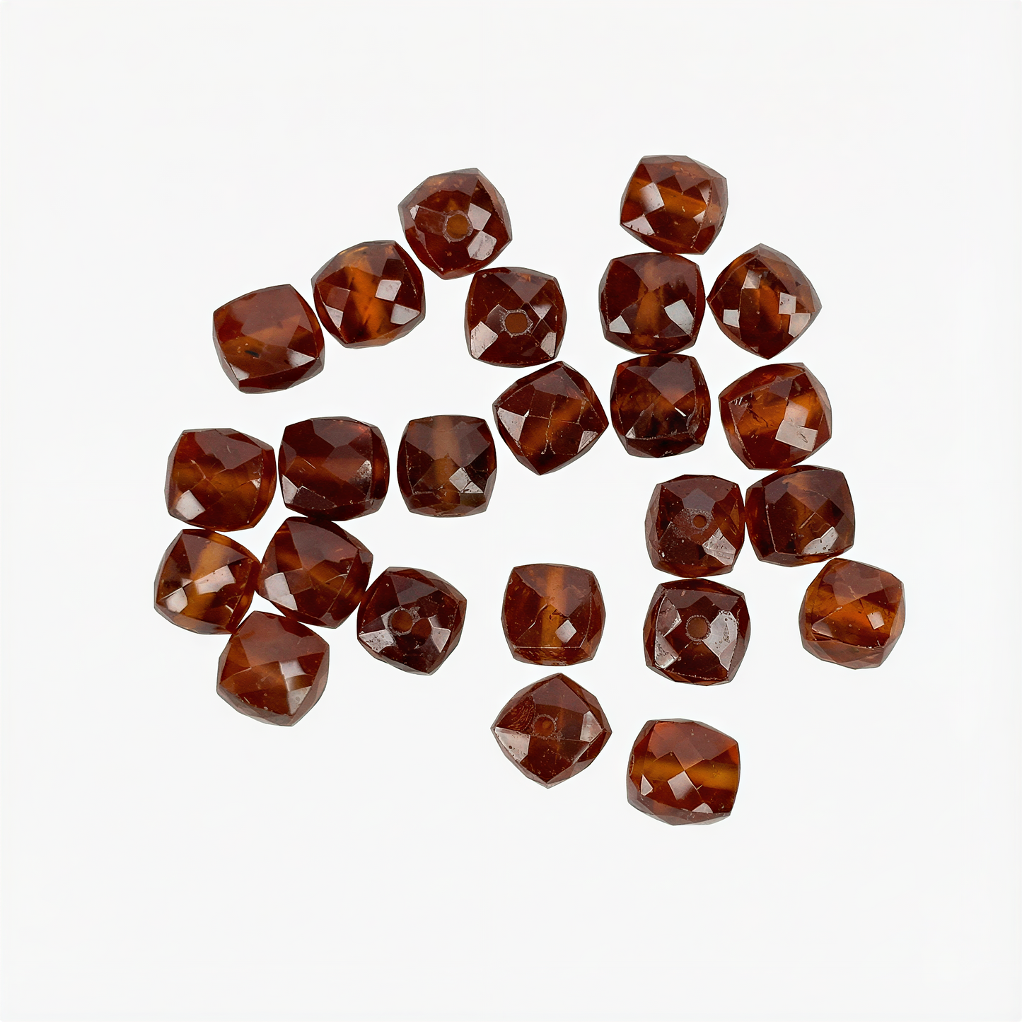 Single hessonite garnet large-facet bead on pure white background, showcasing warm amber tones and polished clarity