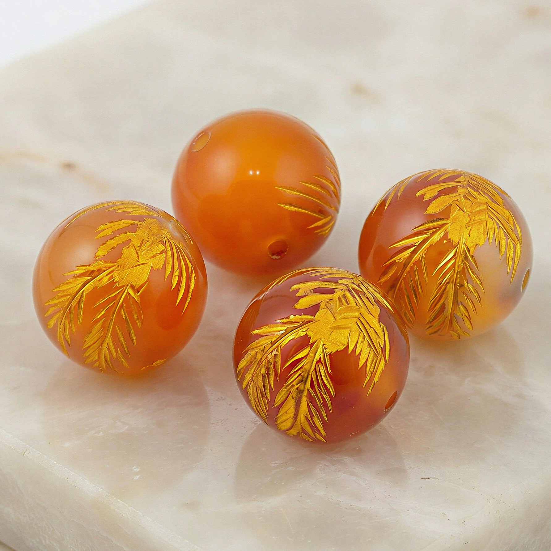 Polished carnelian phoenix carved 12mm round bead showcased with refined clarity, warm tones, and subtle natural texture