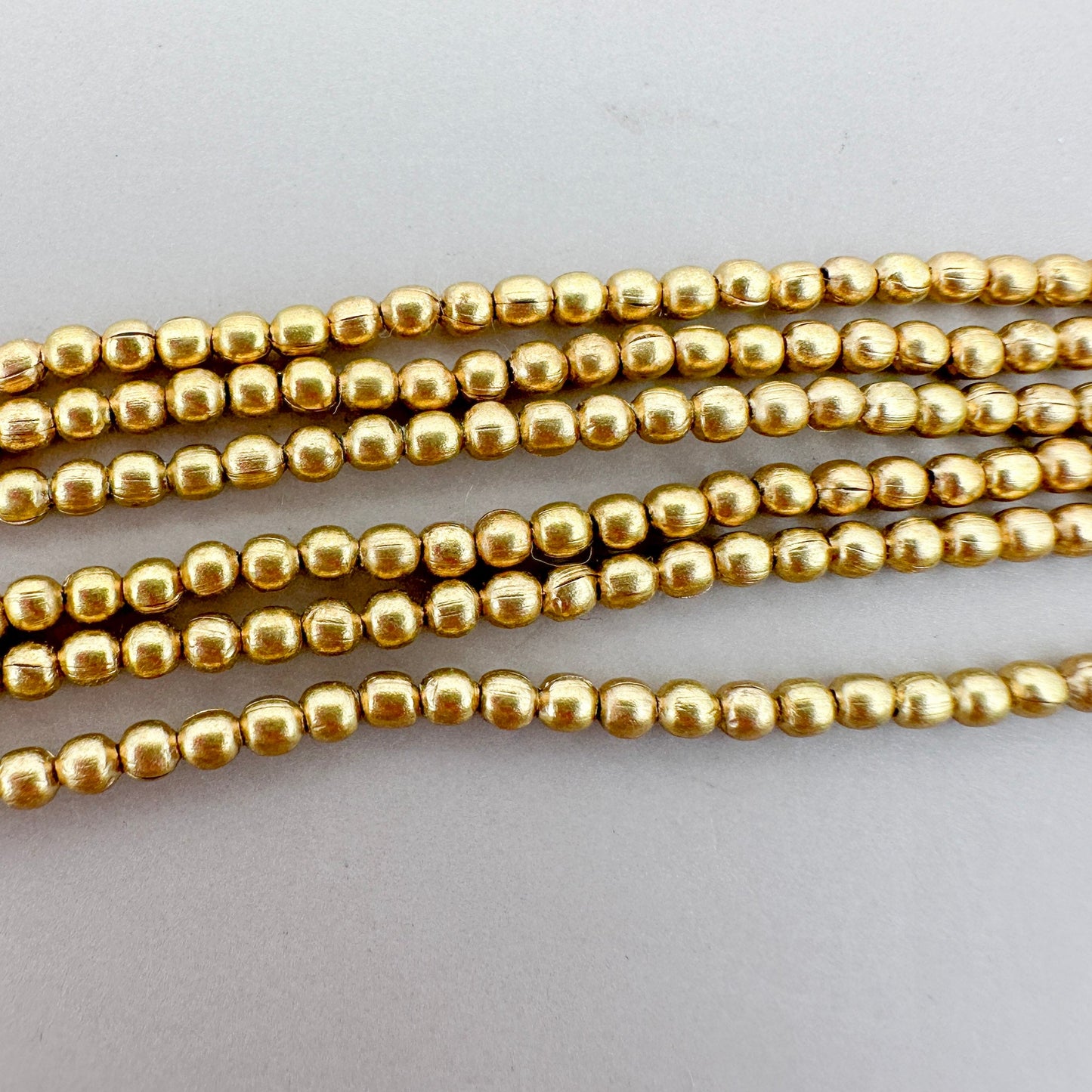 2mm Round Brass Bead (3 Color Options) - 24" Strand (GEM2237)