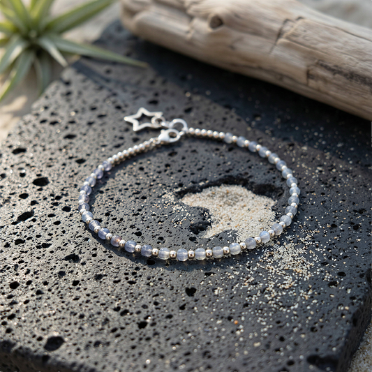 Tin box bracelet kit styled outdoors with earth tones, organic textures, soft Hawaiian-inspired natural light