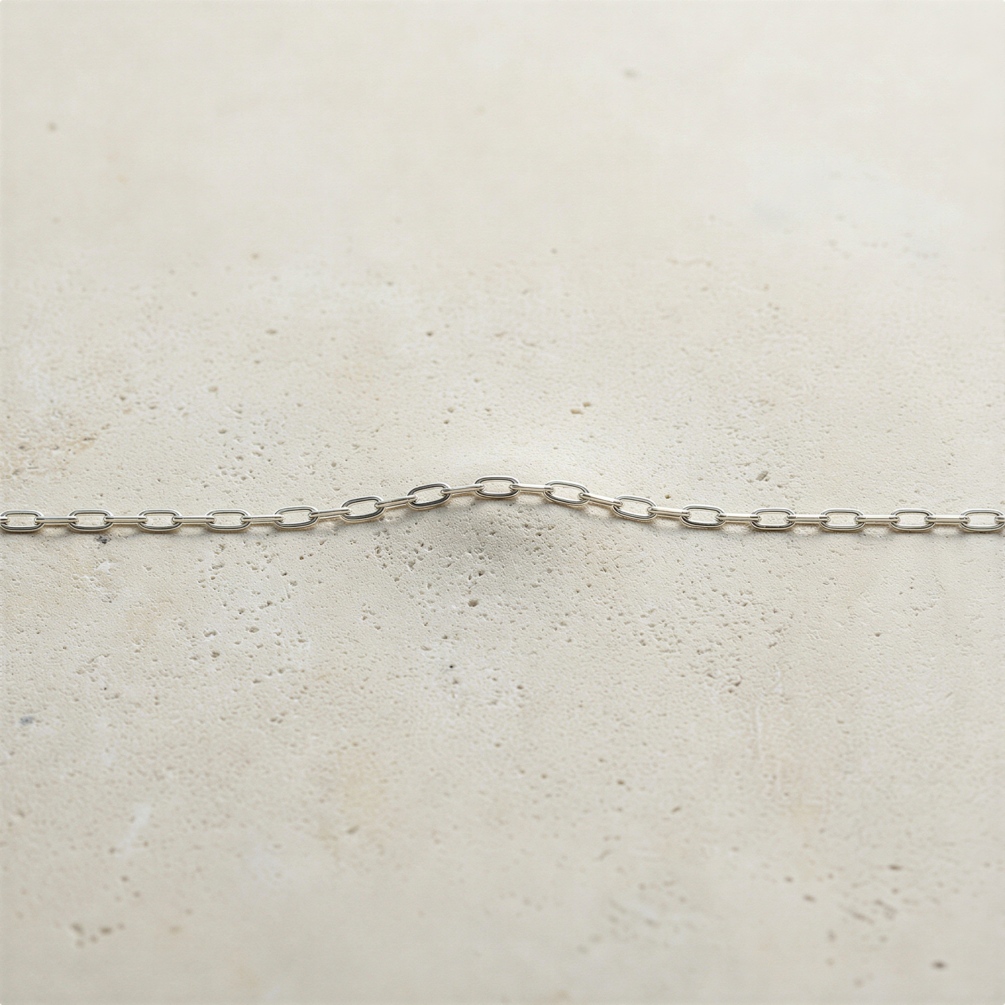 Sterling silver and gold filled cable chain styled with serene lighting, minimal backdrop, and effortless Neiman’s elegance