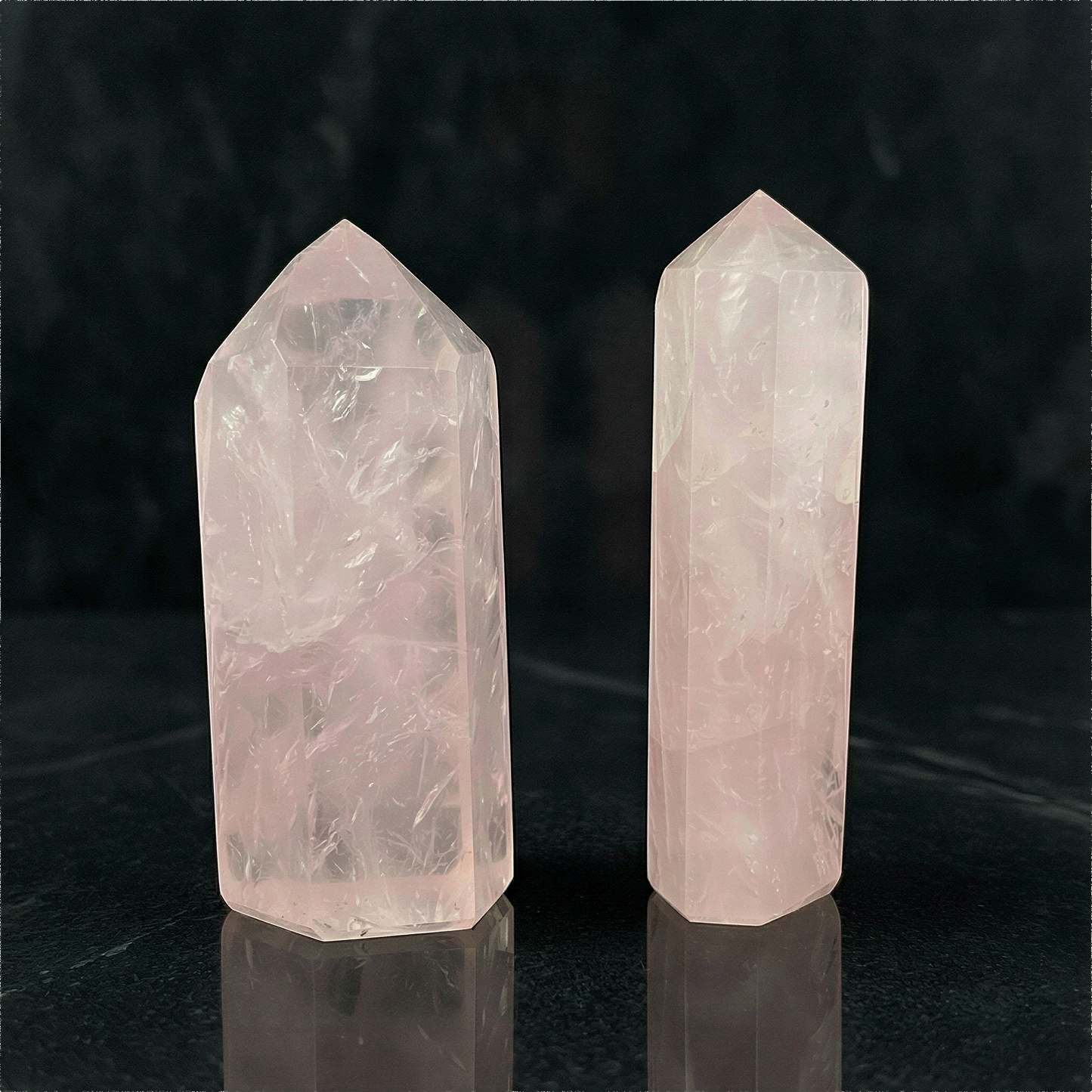 Mini rose quartz point on neutral backdrop with soft studio light, enhanced clarity and gentle blush tones