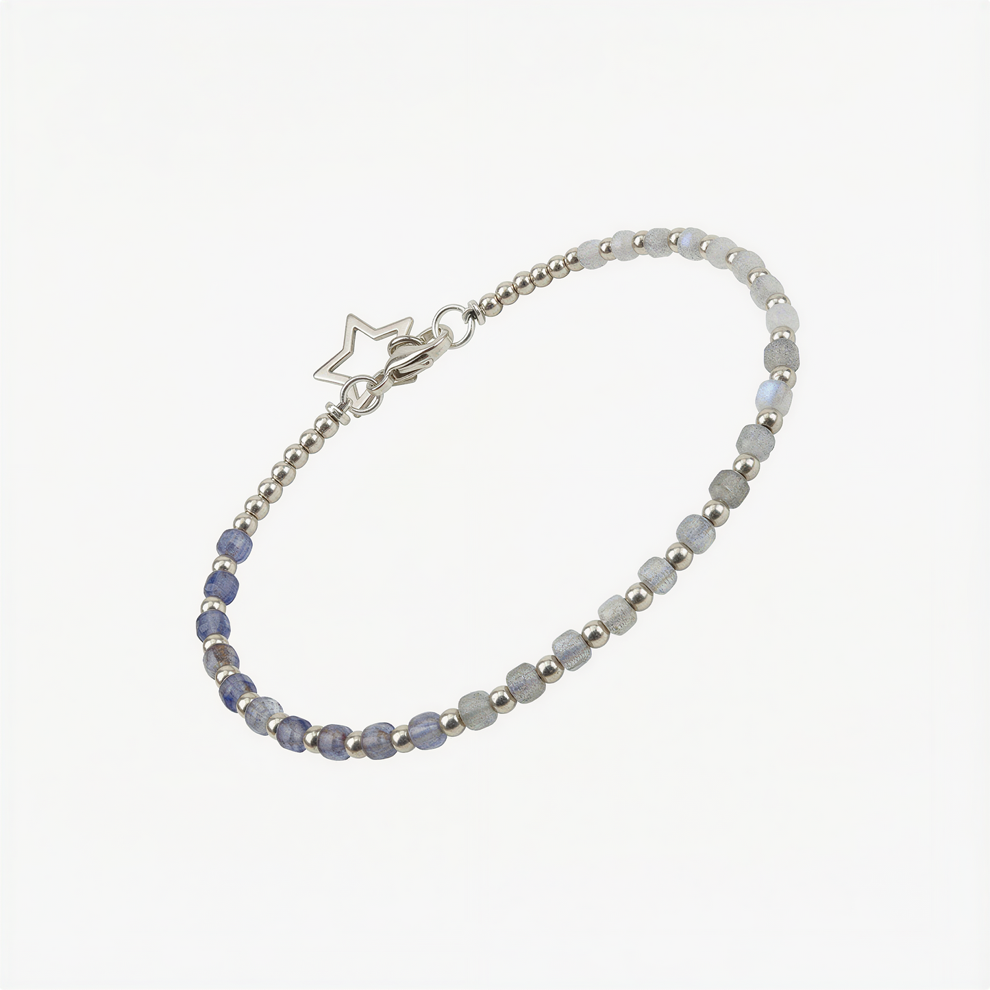 Tin box bracelet kit neatly arranged on pure white background with beads, cord, and instructions.