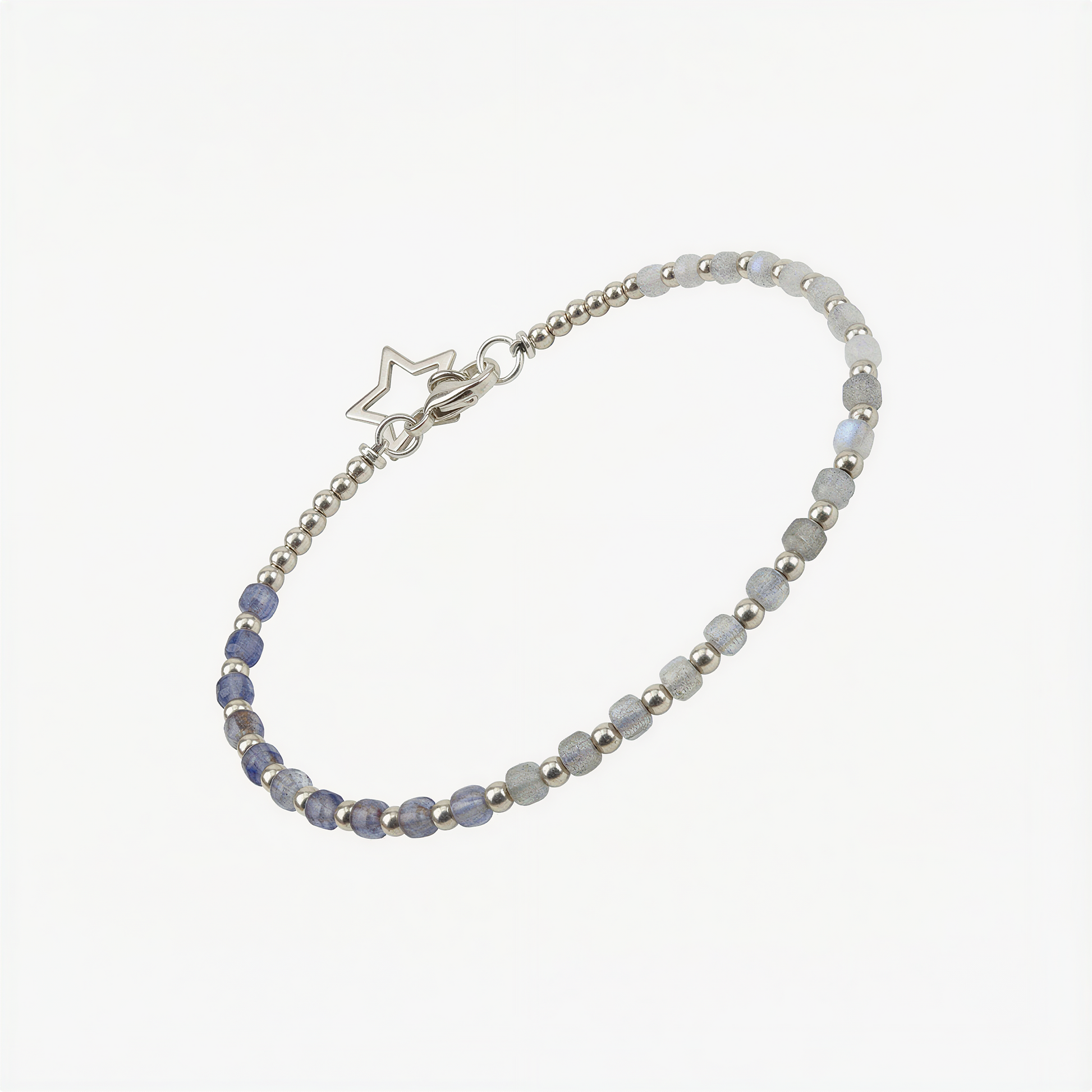 Tin box bracelet kit neatly arranged on pure white background with beads, cord, and instructions.