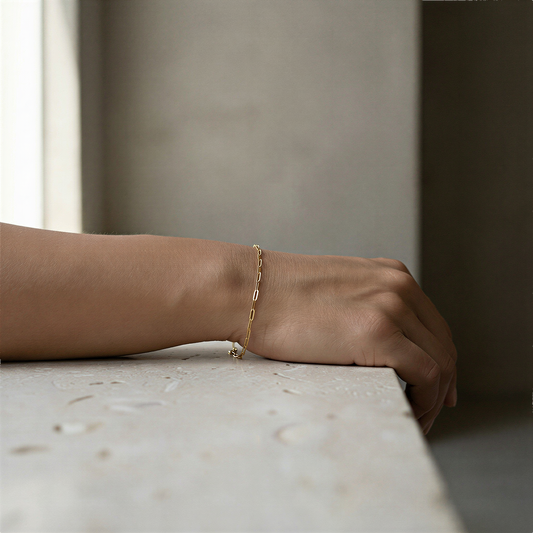 Flat paperclip chain necklace in silver, gold, and rose gold styled in serene, balanced Neiman-inspired setting