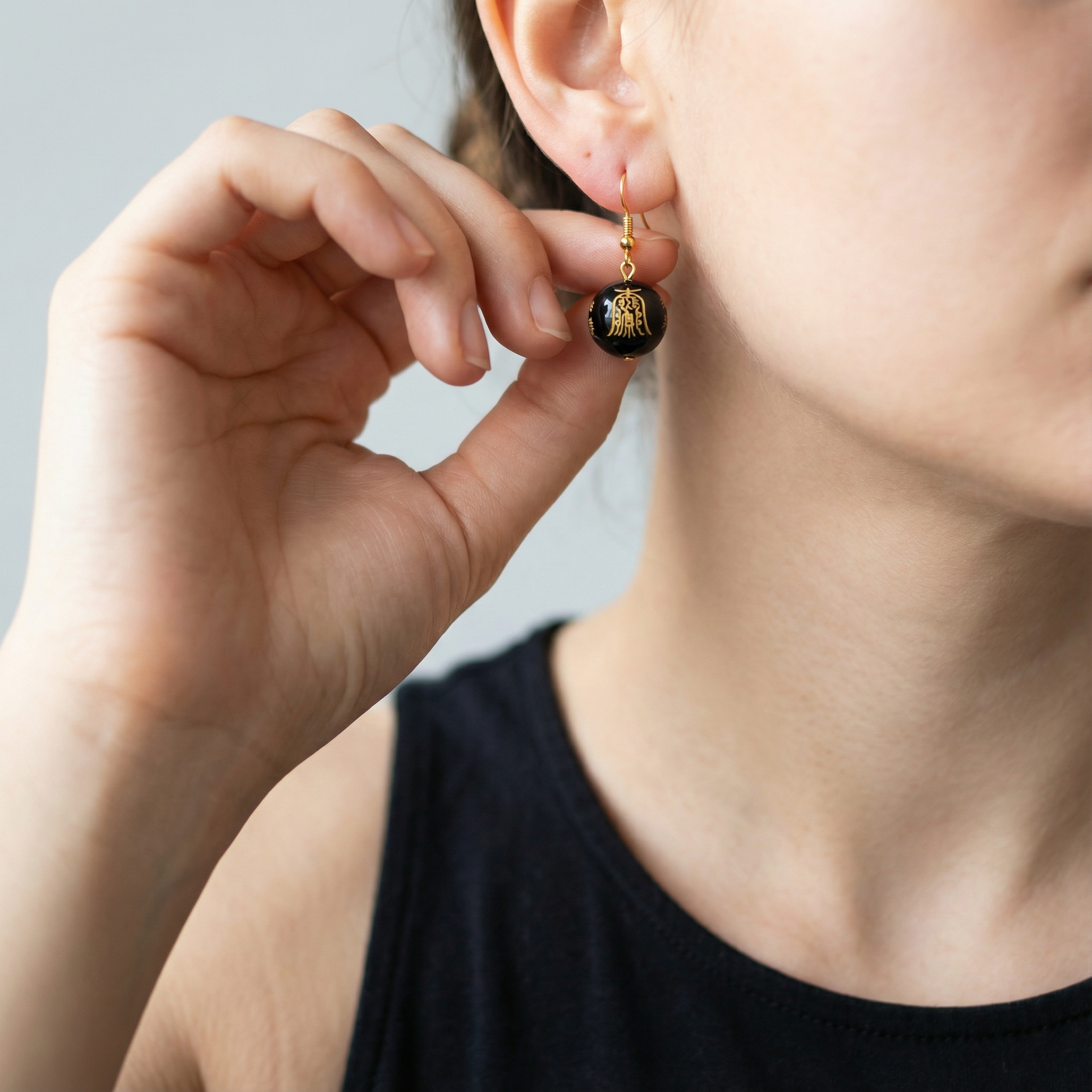 Gold Protection Symbols on Black Agate Smooth Round Bead - 7.25" Strand (GEM2459) – AI Studio Image (Transformed)