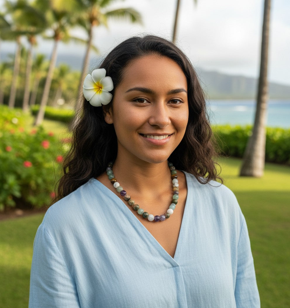 AI Enhanced – make a simple beaded necklace with these mixed 10mm beads.  display on a local model at a park in hawaii.