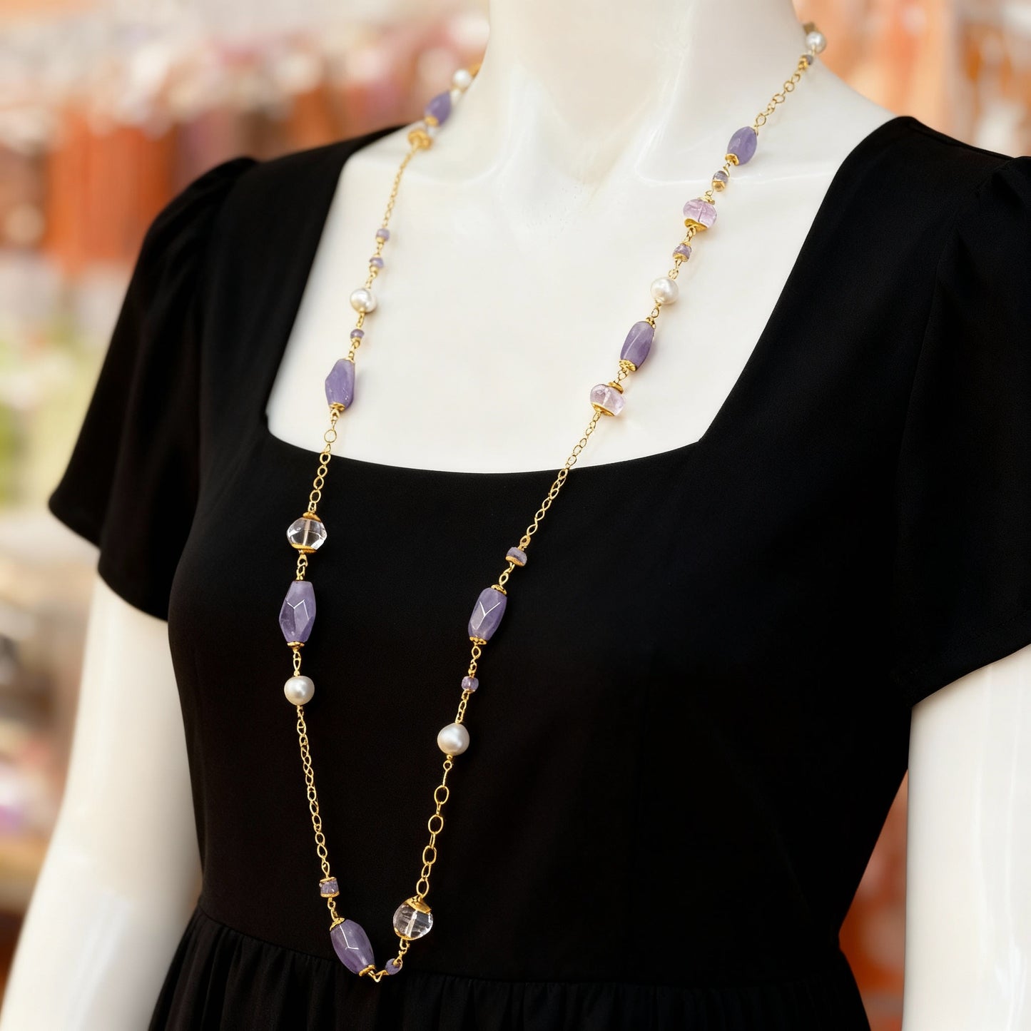 AI Enhanced – show necklace on person in simple black dress