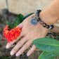 Prayer Coin Amulet Stretchy Cord Bracelet w/ Flower Bead