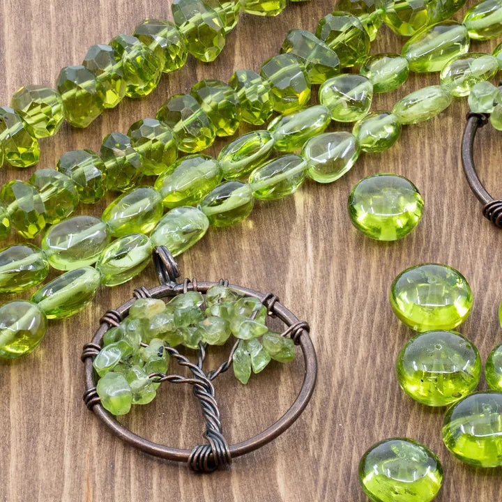 Green Peridot bead strands and a copper Tree of Life focal