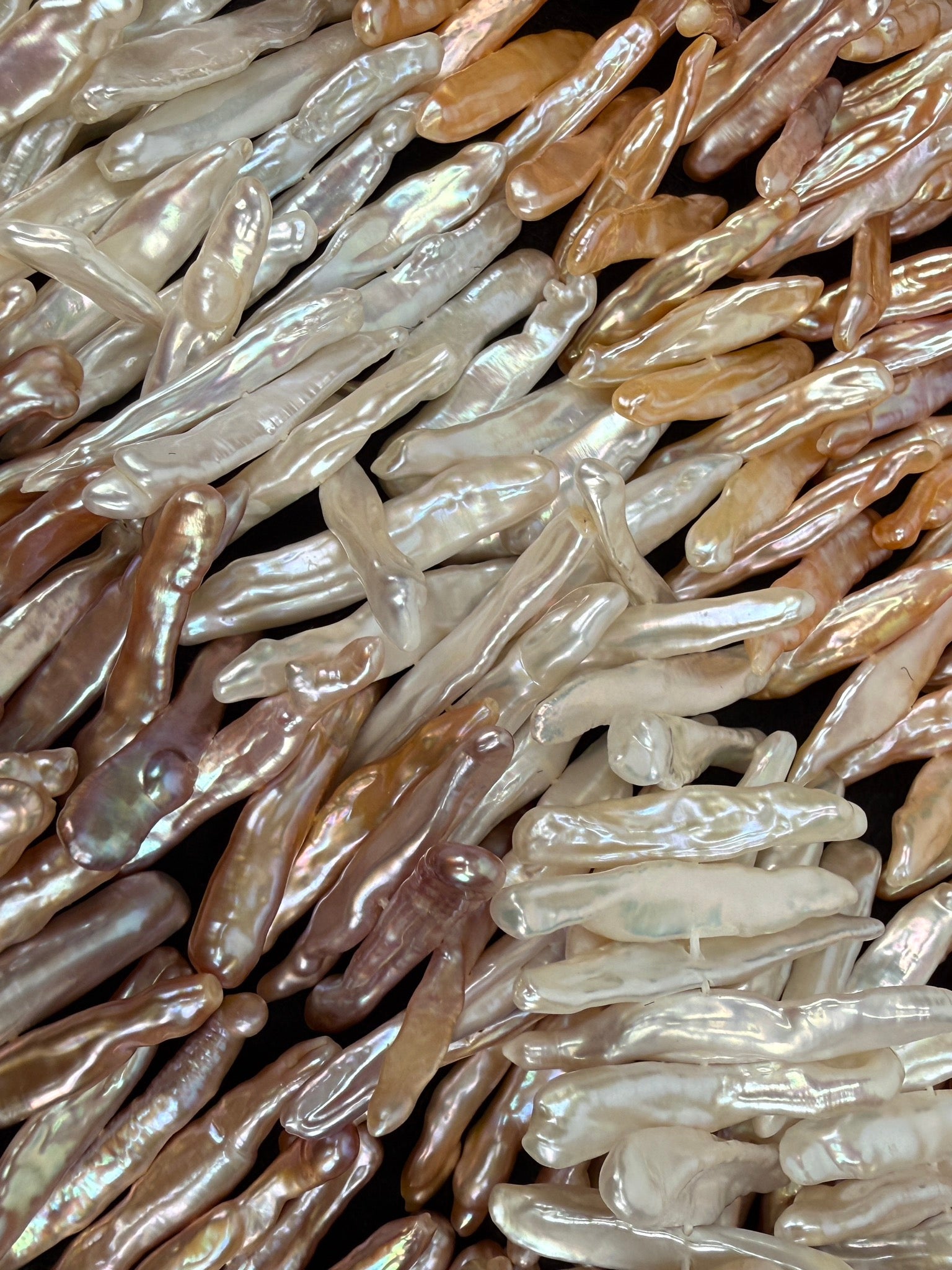 Freshwater stick pearls in white, blush, peach, and mauve tones